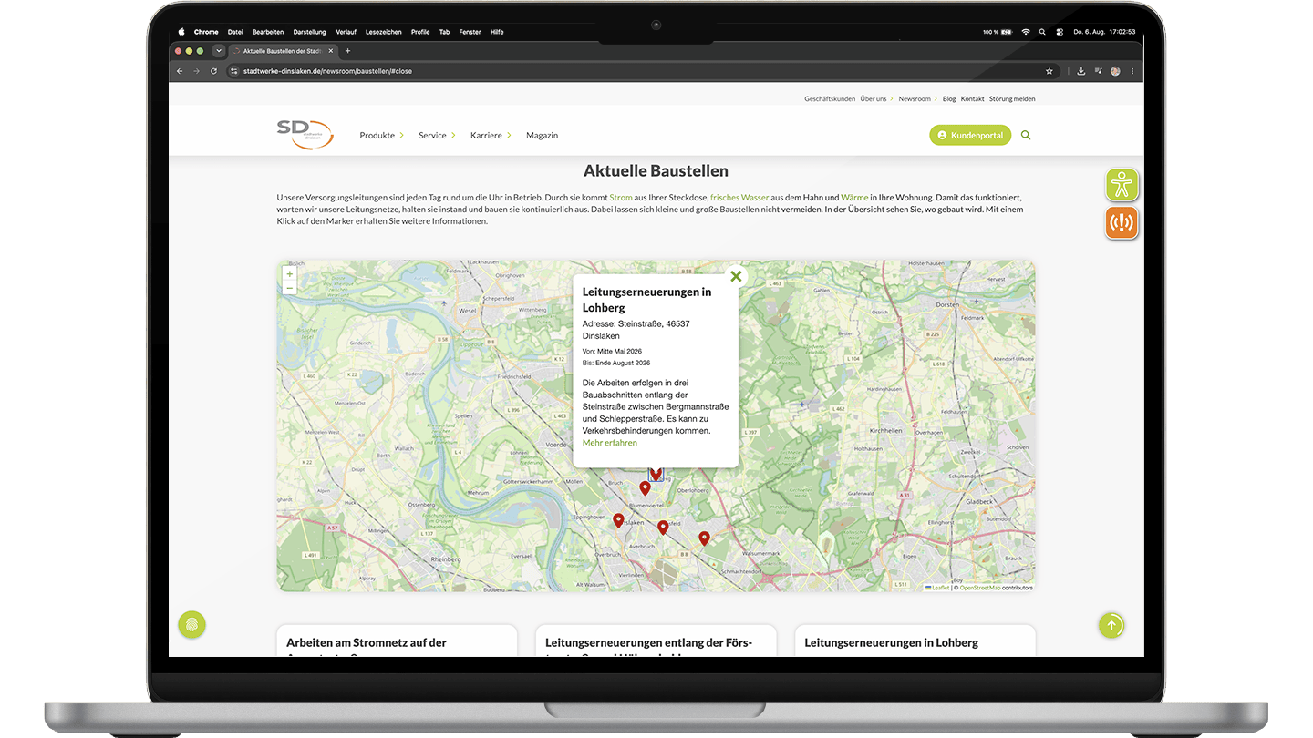 Silberner Laptop zeigt eine Straßenkarte mit mehreren roten Markern und einem geöffneten Informationsfenster in der Mitte.